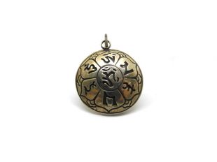 Silver disk Om pendant